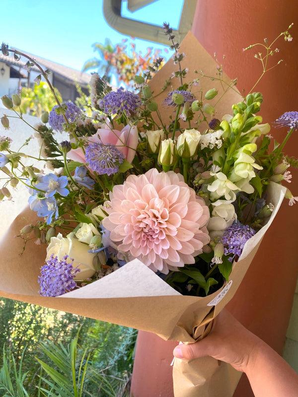 Soft and Dreamy Classic Bouquet featuring dahlias, delphinium and roses. 